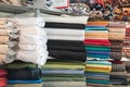 Fabric store with stacks of colorful textiles Royalty Free Stock Photo