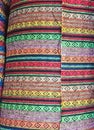 Fabric Store, Traditional fabric store with stacks of colorful textiles, fabric rolls at market stall - textile industry. Royalty Free Stock Photo