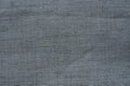 Fabric texture background. Gray fabric with weave. Natural slightly wrinkled look of the material. Uniform copy space Royalty Free Stock Photo