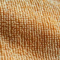Fabric texture. Fabric background. Texture of a soft yellow fabric canvas. Macro image. Selective focus Royalty Free Stock Photo
