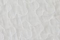 Fabric texture patterns stitched seams. Ties on the white lining material. Curved lines of seams on the clothes Royalty Free Stock Photo