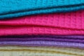 Fabric texture from a row of colored woolen shawls Royalty Free Stock Photo