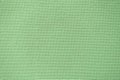 Fabric texture with small holes, green background Royalty Free Stock Photo