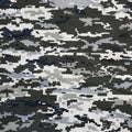 Fabric with texture of Ukrainian military pixeled camouflage. Cloth with camo pattern in grey, brown and green pixel shapes.