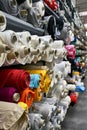 Fabric warehouse with many multicolored textile rolls