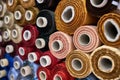 Fabric warehouse with many multicolored textile rolls