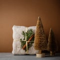 Fabric wrapped gifts, Zero waste beauty body care and house cleaning items and wooden Christmas decorations Royalty Free Stock Photo