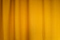 Fabric yellow curtains with folds . Abstract background, curtain, drapes gold fabric. Royalty Free Stock Photo