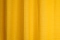 Fabric yellow curtains with folds . Abstract background, curtain, drapes gold fabric. Royalty Free Stock Photo