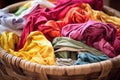 fabrics flowing out from a large basket