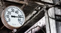 Steam manometer in an old factory building Royalty Free Stock Photo