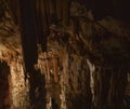 Fabulous abstract background of stalactites, stalagmites and stalagnates in a cave underground, horizonta
