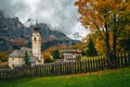 Fabulous alpine village with traditional mountain church, Dolomites, Colfosco, Italy Royalty Free Stock Photo