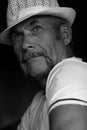 Fabulous at any age concept. Close up portrait of handsome mature man with moustache in white shirt and hat.