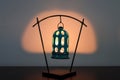 A fabulous ceramic lantern stands on the table and barely illuminates the room.