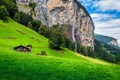 Fabulous Lauterbrunnen alpine village and Staubbach waterfall in background, Switzerland Royalty Free Stock Photo