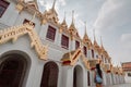 Fabulous, mystical, Buddhist Asian temple with pagodas and statues. Woman impressed with the beauty of the place