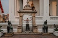 Fabulous, mystical, Buddhist Asian temple. The woman is impressed by the beauty of the statues. The girl looks at the