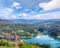 Fabulous View of the Cles Castel, the Santa Giustina Lake and lots of apple plantations Royalty Free Stock Photo