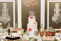 Fabulous wedding cake with the macaroons and cupcakes