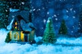 fabulous winter house in the forest at night, the moon is shining, it is snowing. New year greeting card Royalty Free Stock Photo