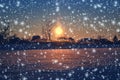 Fabulous winter landscape with sunrise and falling snow effect