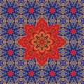 Fabulously beautiful ornament with a large red flower - a mandala against a background of beautiful blue flowers.