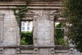 Facade of abandoned house overgrown with green ivy Royalty Free Stock Photo