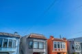 Facade of adjacent small houses with stairs at the entrance on the side at San Francisco, California