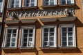 Facade of an adorned historical building in Swietojanska street, Warsaw, Poland