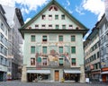 Facade of an ancient colourful painted house on Weinmarkt square in Lucerne old town Switzerland