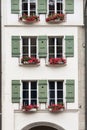 Facade of ancient mansion with shutters an flower boxes, Bern, Switzerland.