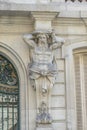 Facade atlante of Real Academia Nacional de Medicina building. Located in Arrieta Street, Madrid, Spain