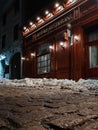 Facade of Auberge-Restaurant Les Filles du roy in winter viewed from a low angle from the cobbled street in Bonsecours street in Royalty Free Stock Photo