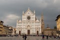 Facade of Basilica Santa Croce with rainy clouds on background. Florence, Tuscany, Italy Royalty Free Stock Photo