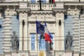 Facade beautiful building of The French Embassy in Riga with two flags, flag of France and EU flag waving on the wind