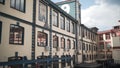 Facade of beautiful factory in city center. Action. Exterior architecture of plant is made in old european style and Royalty Free Stock Photo