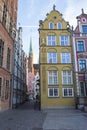 The facade of the beautiful historic building on the street of the Old Town of Gdansk. Poland. Royalty Free Stock Photo