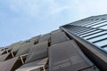 Facade of a beautiful, modern building, against the blue sky. View from below. Architecture Royalty Free Stock Photo