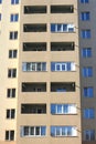 Facade of a beautiful multi-storey modern building with windows and balconies close-up Royalty Free Stock Photo