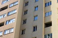 Facade of a beautiful multi-storey modern building with windows and balconies close-up Royalty Free Stock Photo