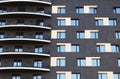 Facade of a black high-rise building with balconies Royalty Free Stock Photo