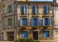 Facade blue windows flowers Brantome France Royalty Free Stock Photo