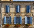 Facade blue windows flowers Brantome France Royalty Free Stock Photo