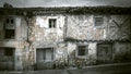 Facade of a house in a village in very poor condition. Several abandoned houses in terrible condition waiting to be