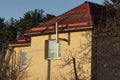 Facade of a brown private house with a white window and a metal chimney Royalty Free Stock Photo