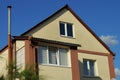 Facade of a brown private house with white windows Royalty Free Stock Photo