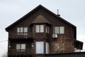 Facade of a brown private wooden house made of logs Royalty Free Stock Photo