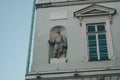 The facade of the building with ancient sculpture. Ancient Greek style in architecture,