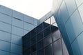 Facade of the building with blue panels and reflective surfaces Royalty Free Stock Photo